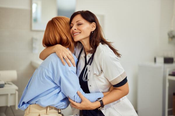 Doctor and patient hugging